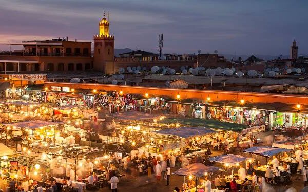 Explore Morocco: Hidden Gems, Must-See Cities & Insider Travel Tips 3 Bustling Jemaa el-Fnaa square in Marrakech with market stalls and crowds of tourists